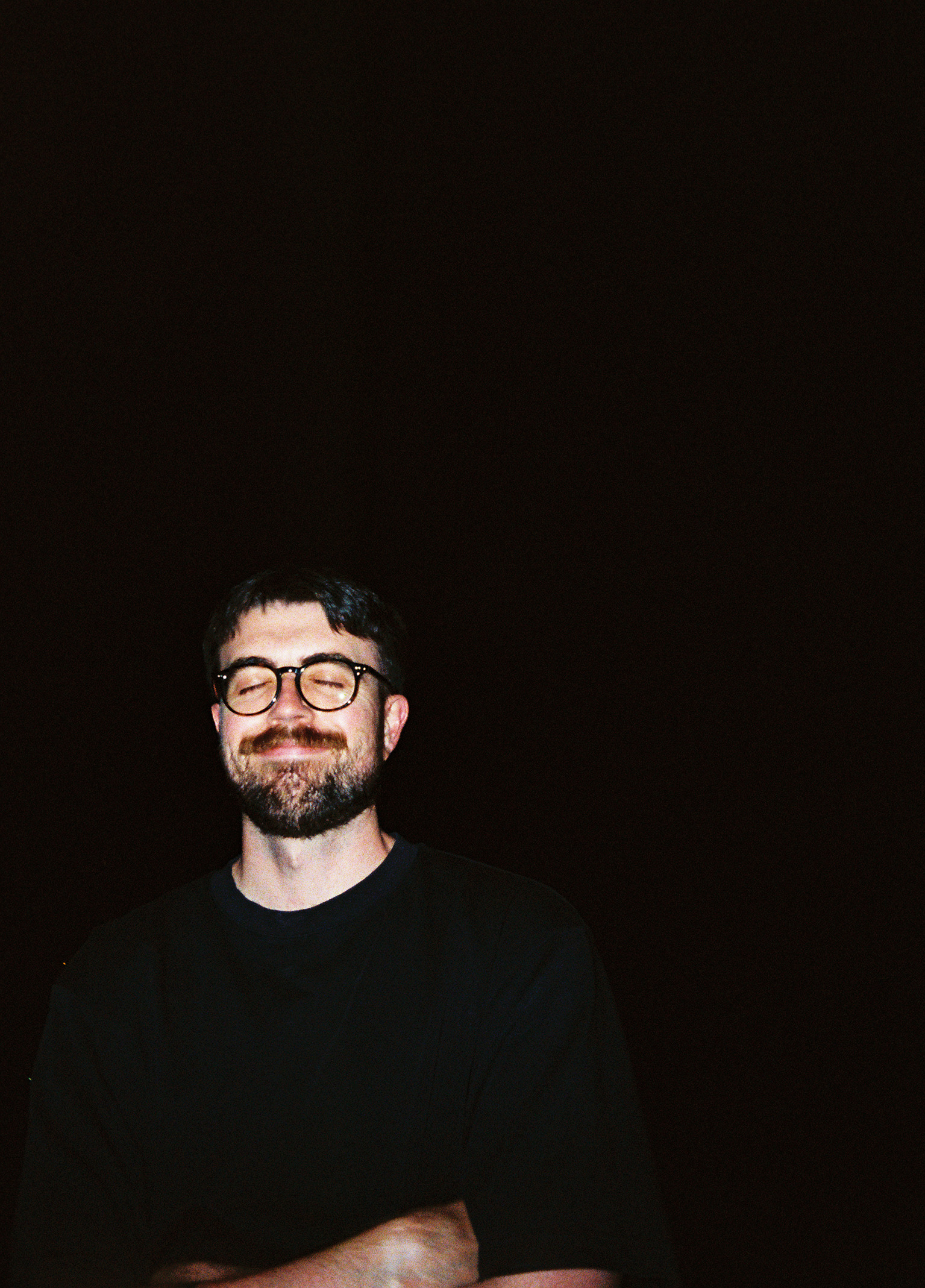 Me smiling in the dark outside.